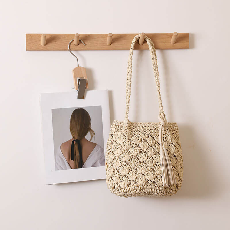 Close-up of beige Tassel breeze woven shoulder bag for women