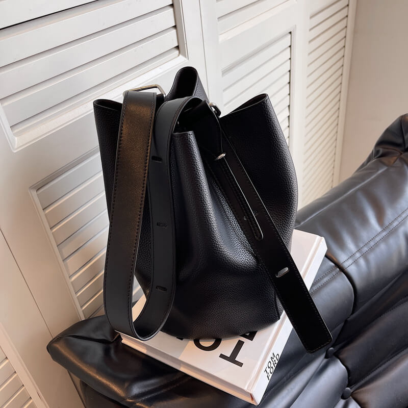 Close-up of black Urbanmood fashion pu leather bucket bag for women