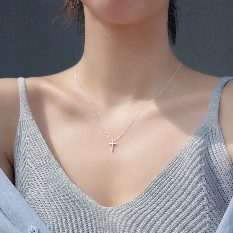 Different angles of model wearing Radiant cross pendant chain necklace for women