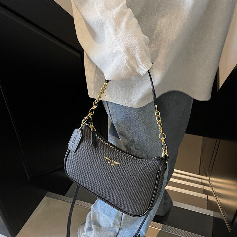 Model carrying black Fashion chain shoulder bag for women