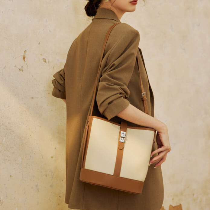 Model carrying Chic cowhide bucket bag for women