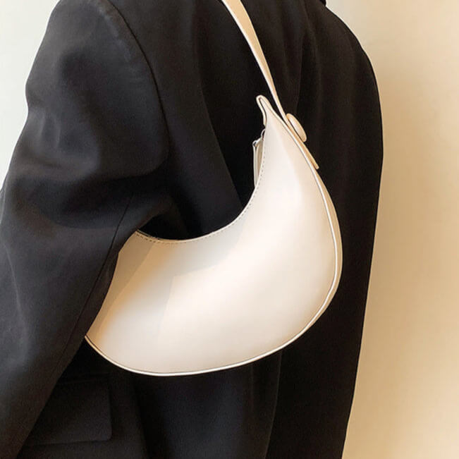 Model carrying white Vintage dumpling shoulder bag for women