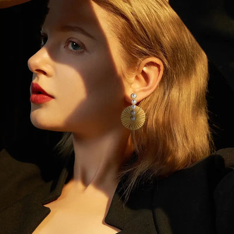 More different angles of Pearluxe gold drop earrings for women