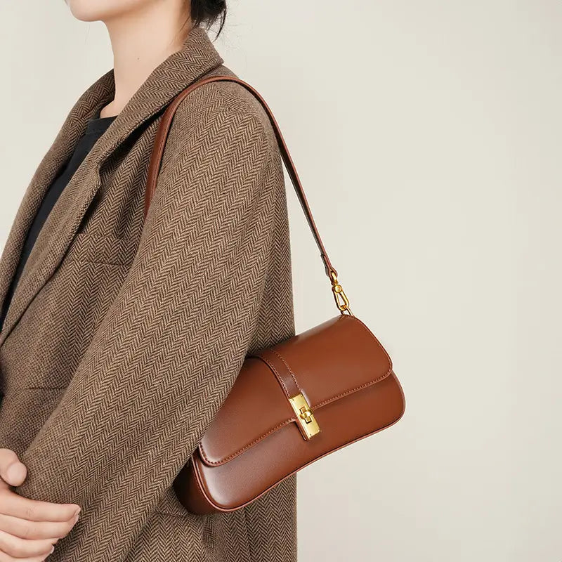 Side view of model carrying Mocha Luxe shoulder bag for women