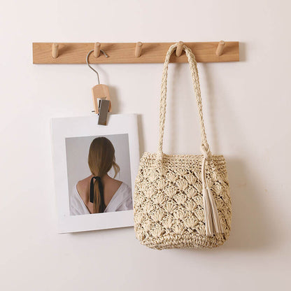 Close-up of beige Tassel breeze woven shoulder bag for women