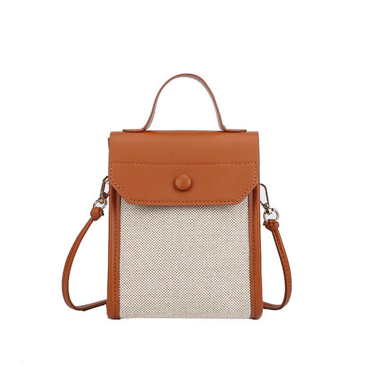 Close-up of brown Petite grace top handle crossbody for women