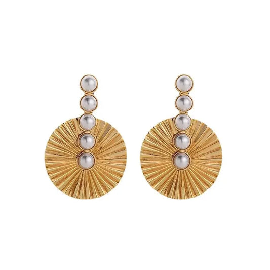 Close-up of Pearluxe gold drop earrings for women