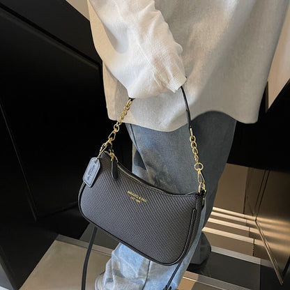 Model carrying black Fashion chain shoulder bag for women