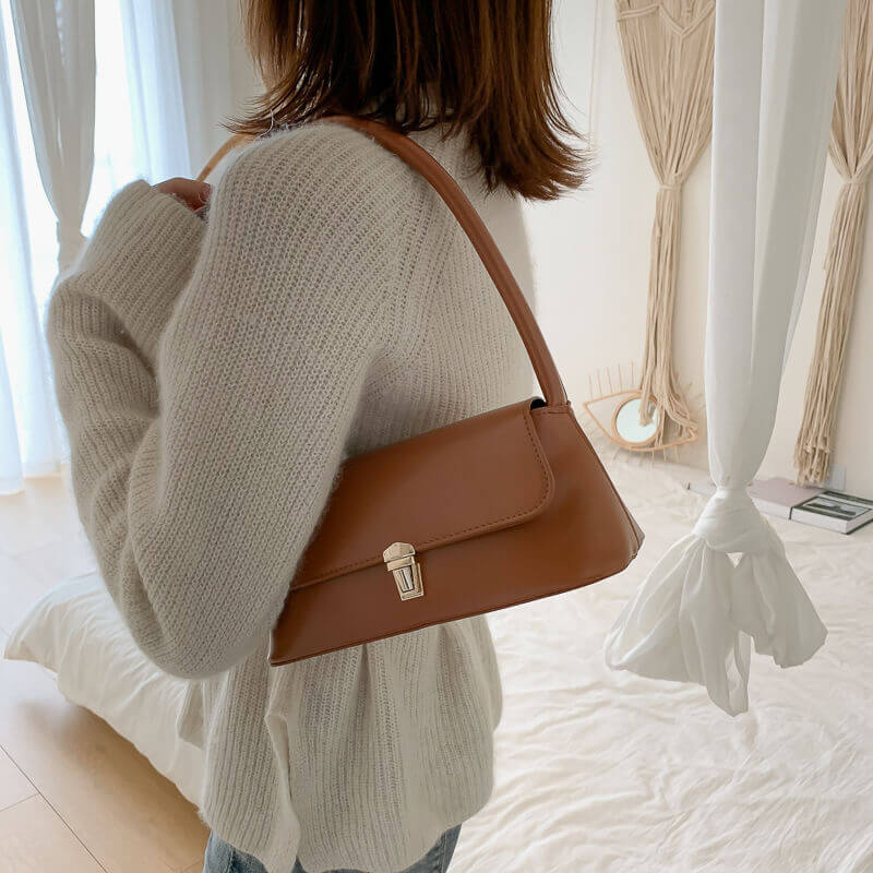 Model carrying light brown Charm French shoulder bag for women 
