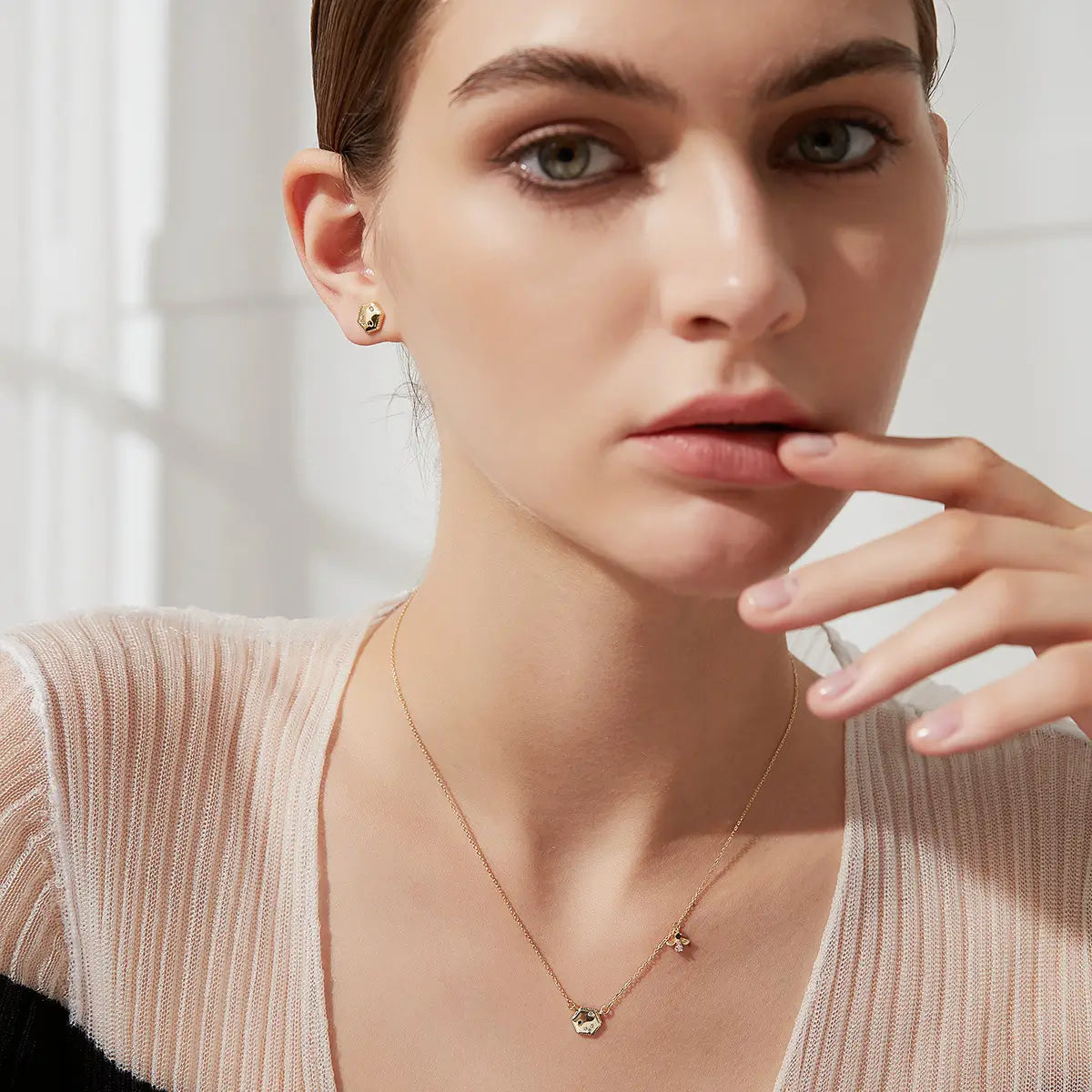 Model wearing Golden Buzz bee pendant necklace for women