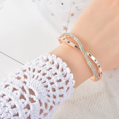 Model wearing Timeline roman cross bracelet for women